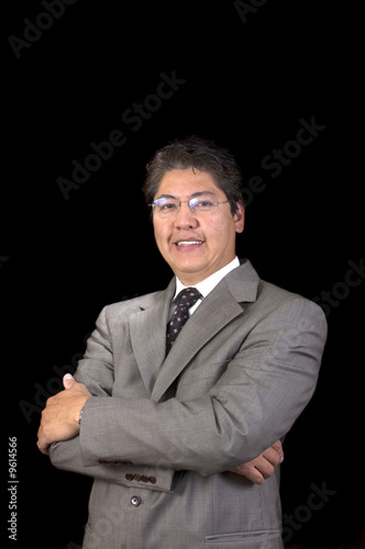 Young handsome smiling Asian businessman