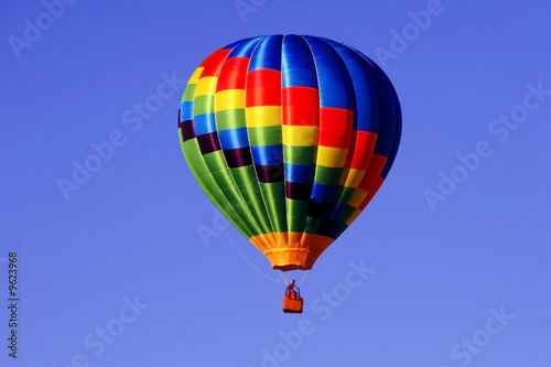 Colorful hot air balloon against a bright blue sky