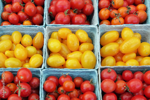 ripe  cherry and grape tomatoes at a farmer s market