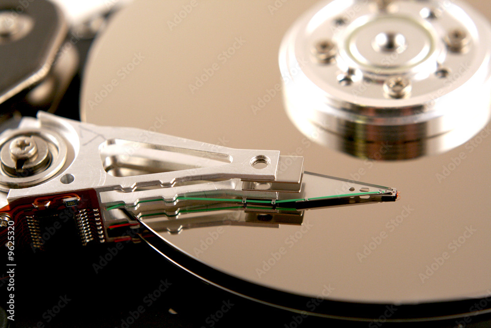 an open computer harddrive showing the disc platters inside an open computer harddrive showing the disc platters inside