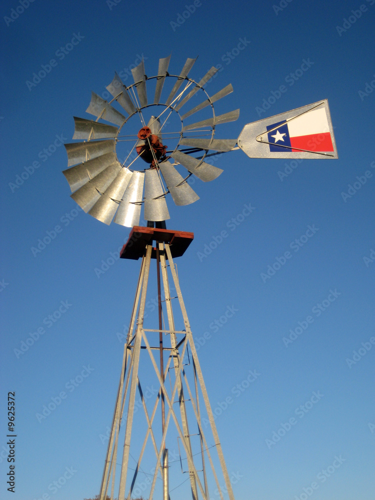A windmill against the blue Texas sky. A windmill against the blue Texas sky.