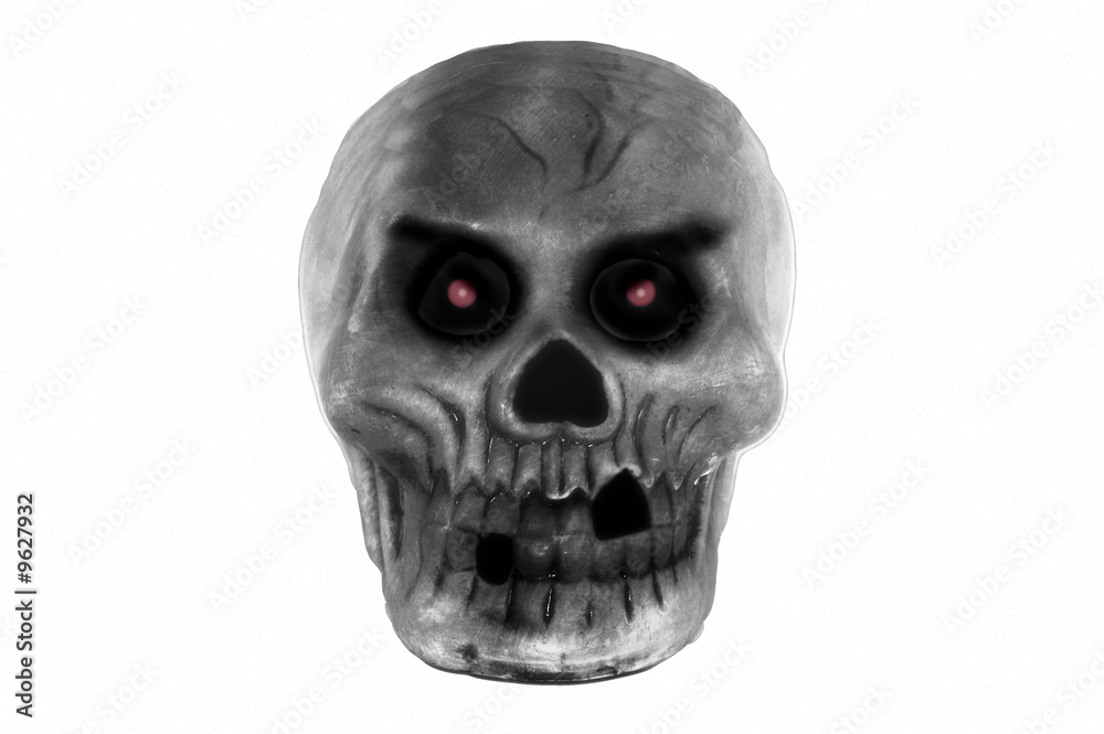 Obraz premium A dark, red eyed skull glares menacingly