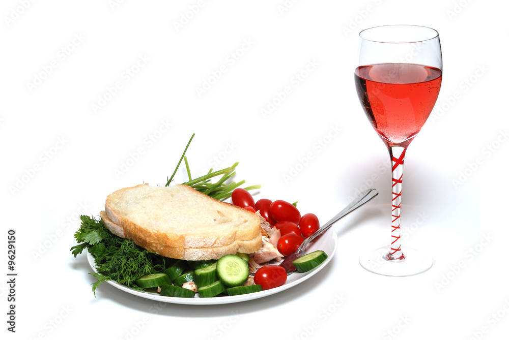 One meal with vegetables and a glass of wine One meal with vegetables and a glass of wine