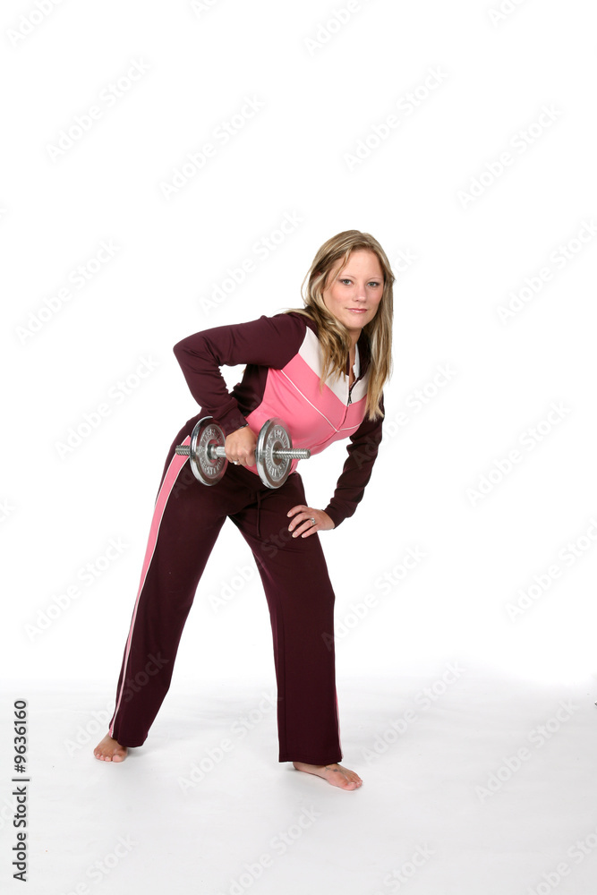 Fototapeta premium pretty woman in pink lifting heavy barbell
