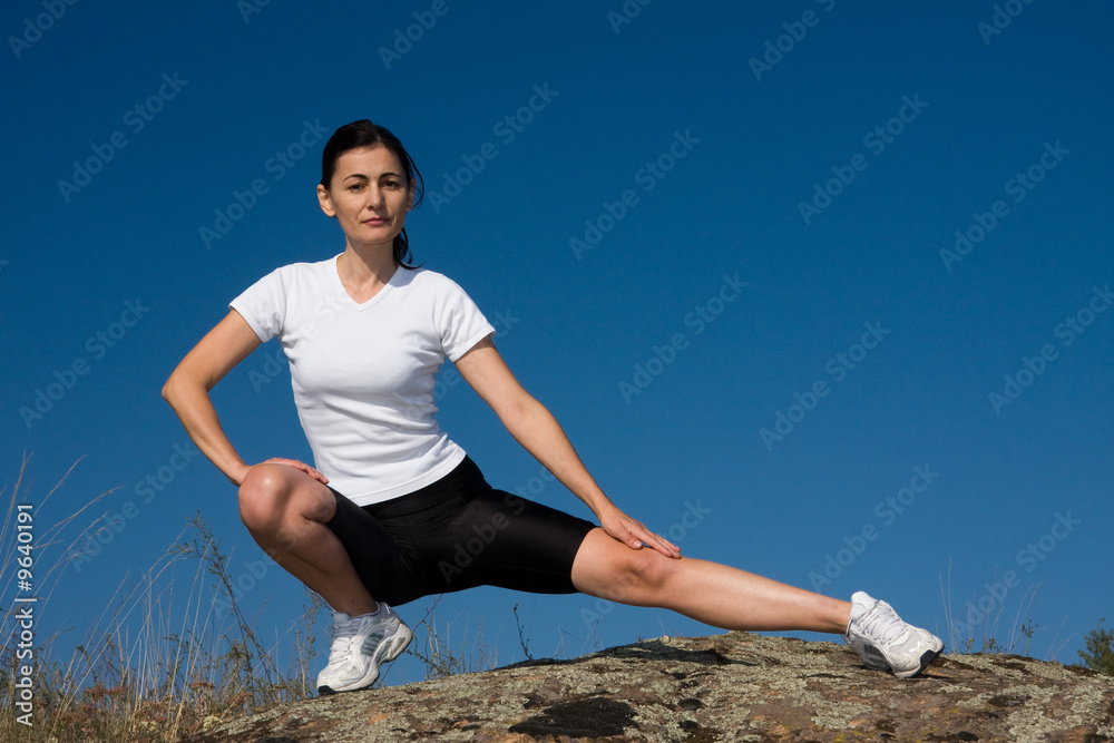 Athletic Woman on sunset blu sky Athletic Woman on sunset blu sky