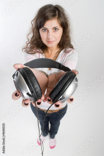 Attractive young lady is listening the music