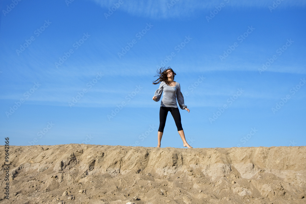 Girl against the backdrop of the sky