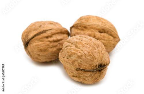 three walnuts on white background