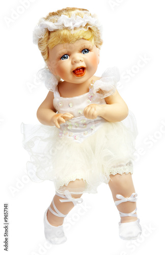Doll in a dress of the bride on a white background.