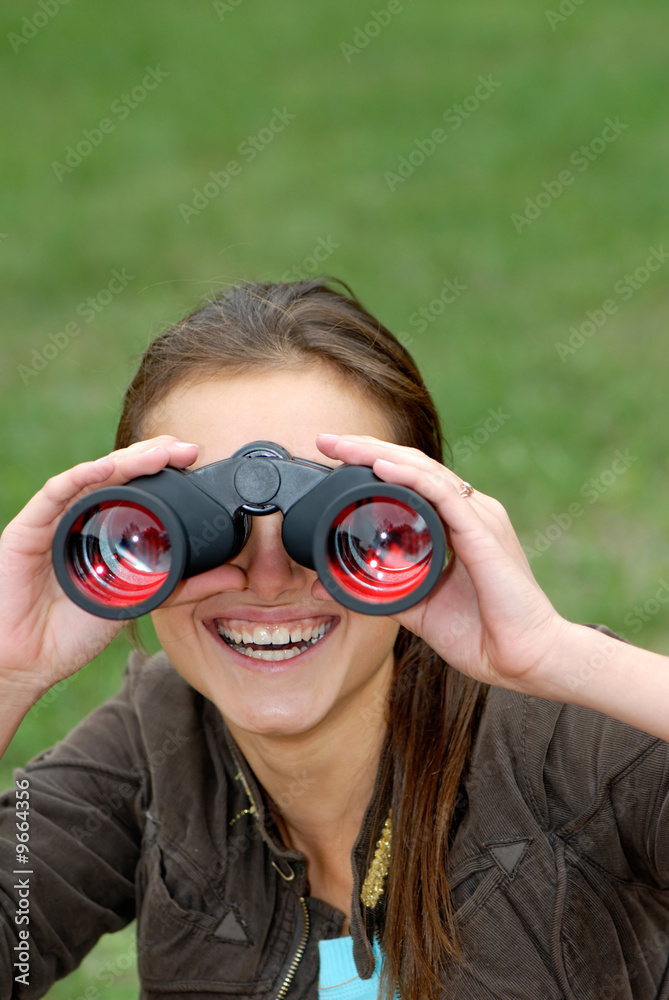 woman looks in the field-glass