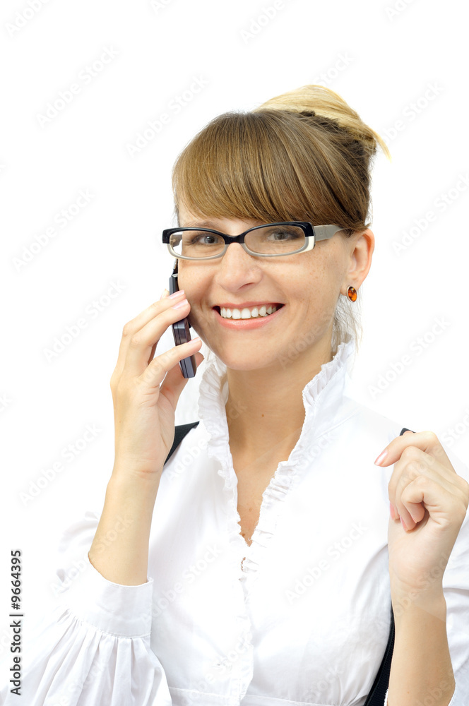 Young businesswoman talks by mobile, isolated on white