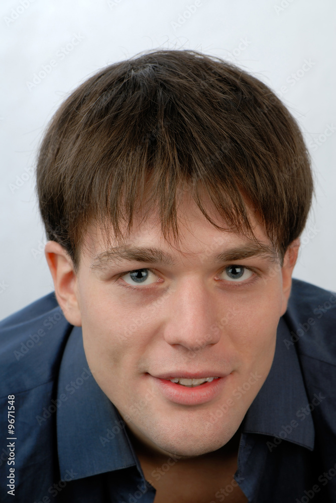 Man's portrait on light background, close up Man's portrait on light background, close up