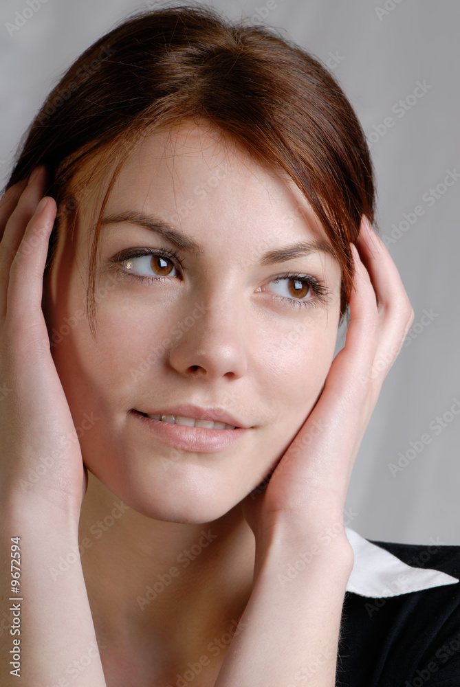 portrait of young woman which holds head hands portrait of young woman which holds head hands