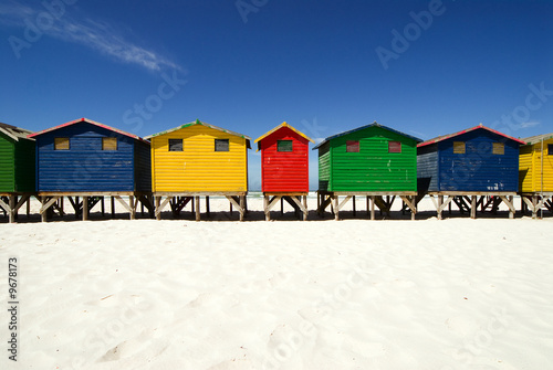 Canvastavla Multi colored beach huts in a row