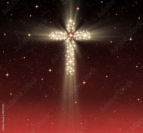 great glowing christian cross in starry night sky photo