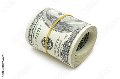 Roll of US money in isolated white background