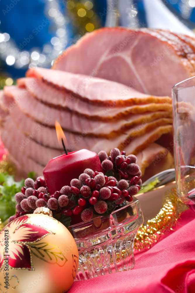 Holiday table setting with delicious whole baked sliced ham Holiday table setting with delicious whole baked sliced ham