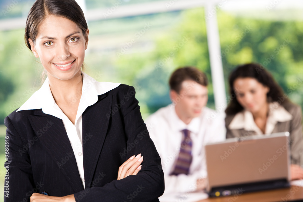 Portrait of happy woman wearing suit looking at camera Portrait of happy woman wearing suit looking at camera