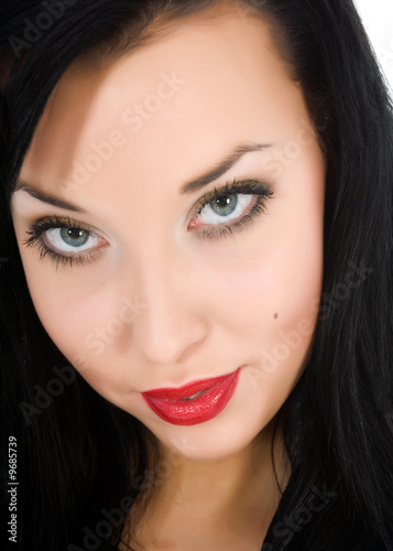 portrait of the brunette with blue eye on white background