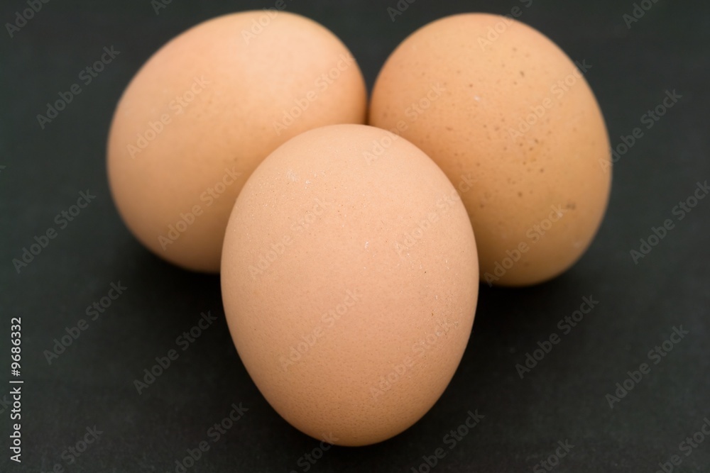 Three eggs on a black background Three eggs on a black background