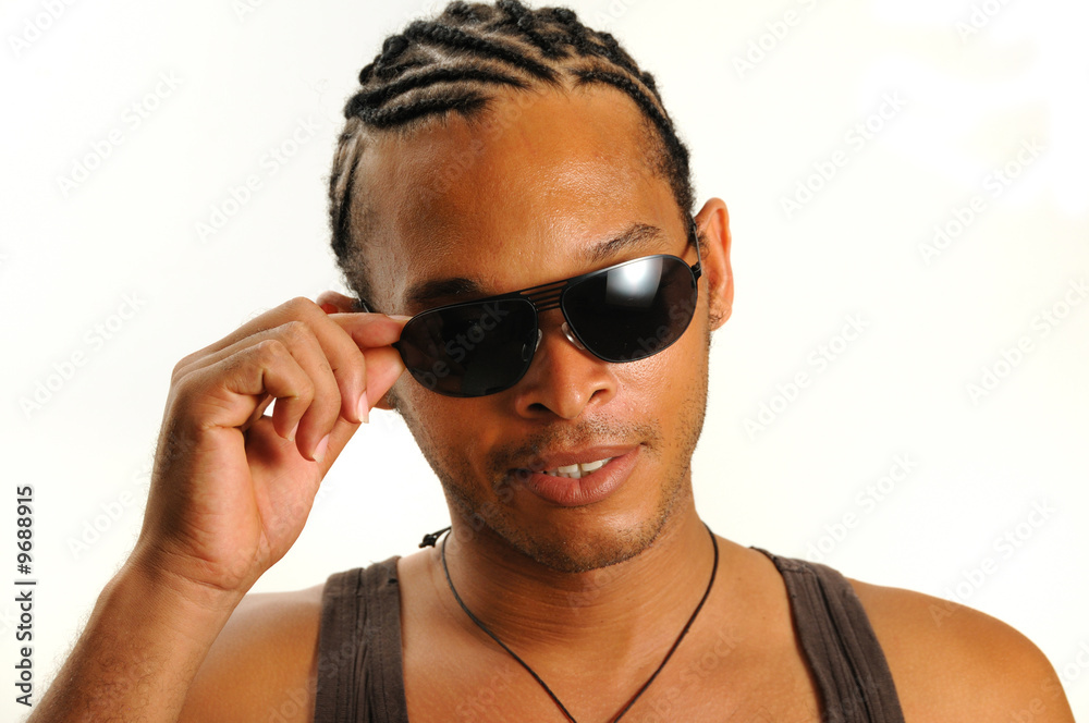 Portrait of young trendy african man wearing sunglasses Portrait of young trendy african man wearing sunglasses