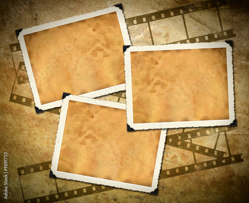 Retro photo framework against an old paper with filmstrip