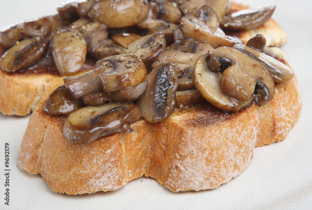 Mushrooms on toast with freshly ground pepper