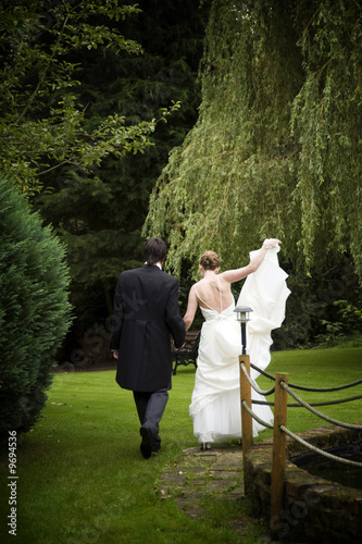 Bride and Groom walking in the garden