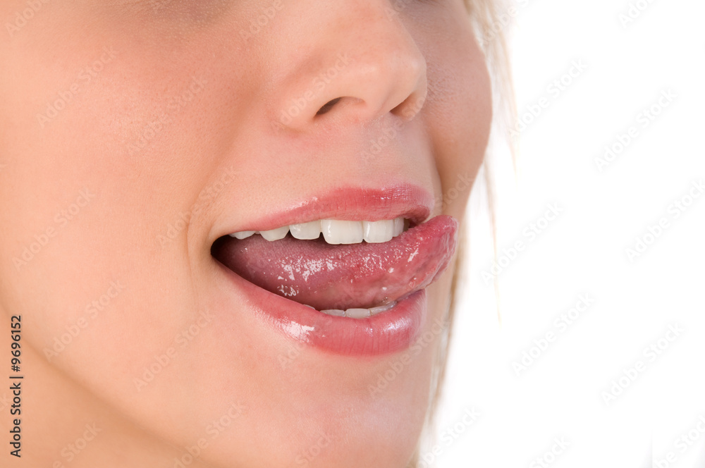 Naklejka premium Beautiful woman leaking teeth with tongue close-up