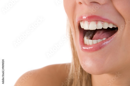 Closeup of beautiful young woman laughing with beautiful teeth