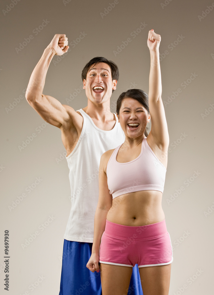 Man and woman cheering and celebrating their success