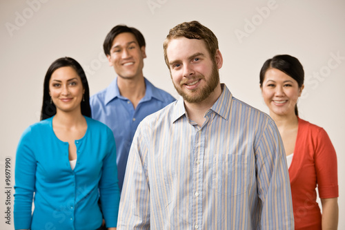 Fotografija Confident man with beard posing with friends