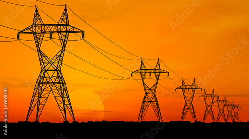 3D Electric powerlines over sunrise photo