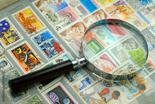 Stamps and Magnifying Glass. photo