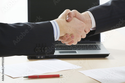 Close-up of two businessmen’s handshake