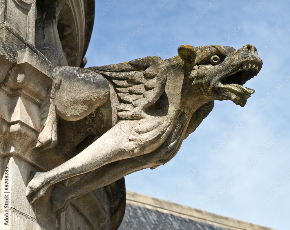Fotografie, Obraz Terrible gargoyle on a cathedral in France