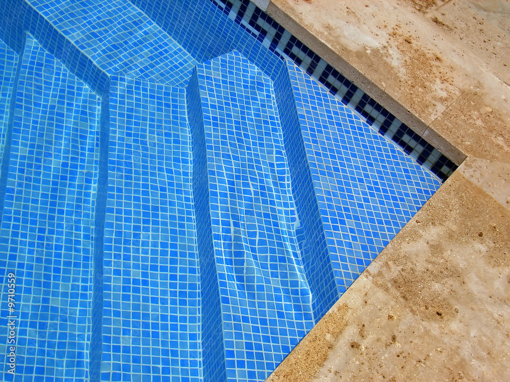 Detail of the steps to enter to a swimming pool in Spain