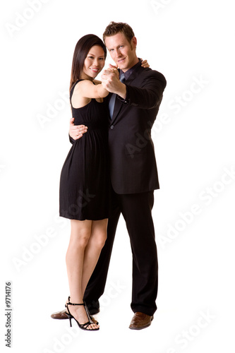 a couple in black dancing and feeling very happy