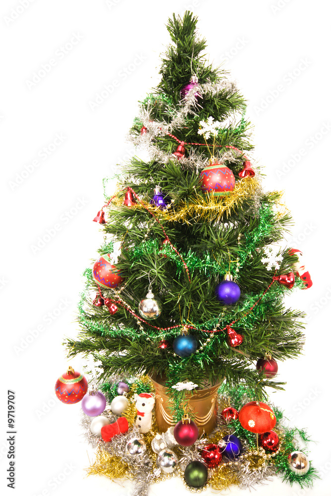 Decorated Christmas tree against a white background Decorated Christmas tree against a white background