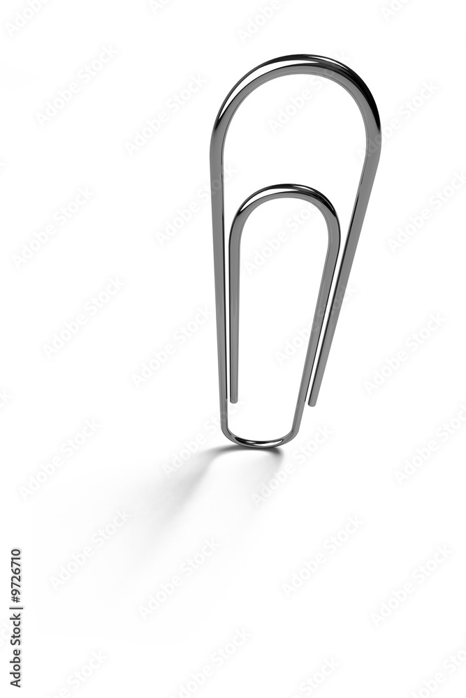 Paper clip standing over white surface with light shadow Paper clip standing over white surface with light shadow