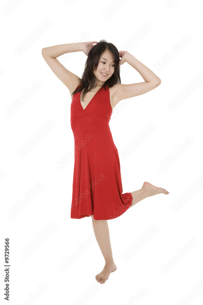 Beautiful Asain woman in a red sundress poing on a white Beautiful Asain woman in a red sundress poing on a white