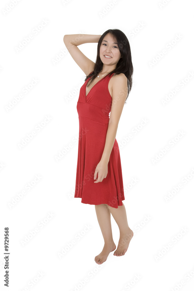 Beautiful Asain woman in a red sundress posing on a white Beautiful Asain woman in a red sundress posing on a white