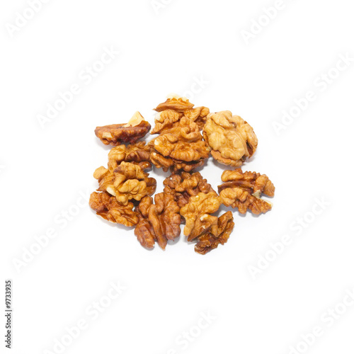 Heap of walnuts isolated on white.