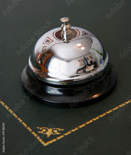 A service bell on a hotel reception desk