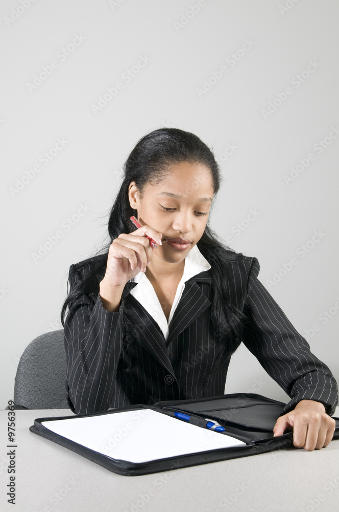 young woman executive working at her desk in office young woman executive working at her desk in office