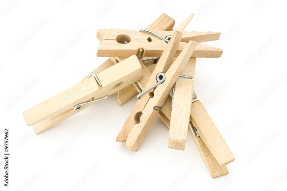 a heap of wooden clothespins on white background a heap of wooden clothespins on white background