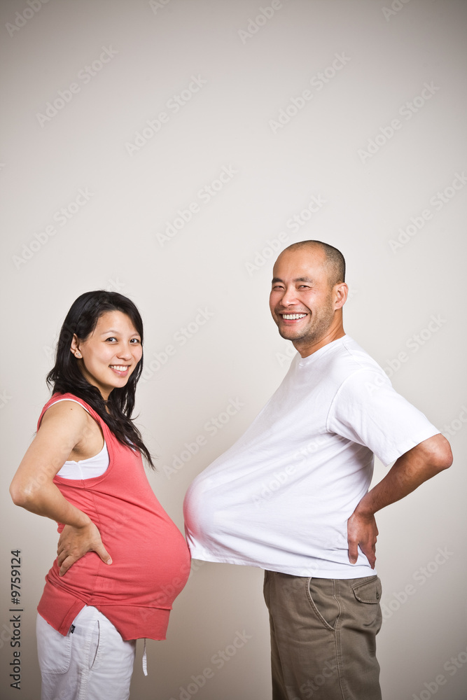 A shot of a happy expecting pregnant asian couple A shot of a happy expecting pregnant asian couple