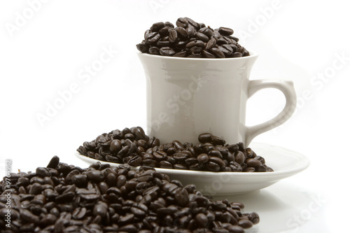 Coffee beans in coffee cup