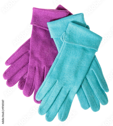 Multi-coloured woollen gloves on a white background...