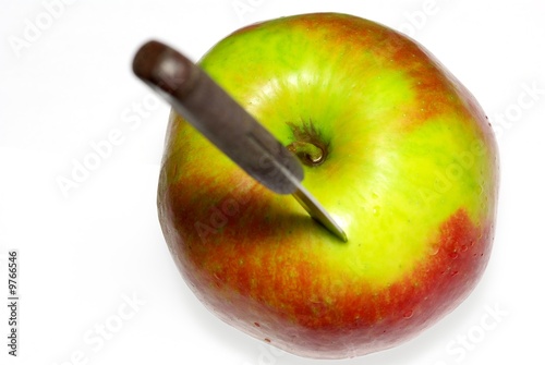 Knife in apple